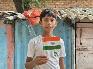 underprivileged child with indian flag